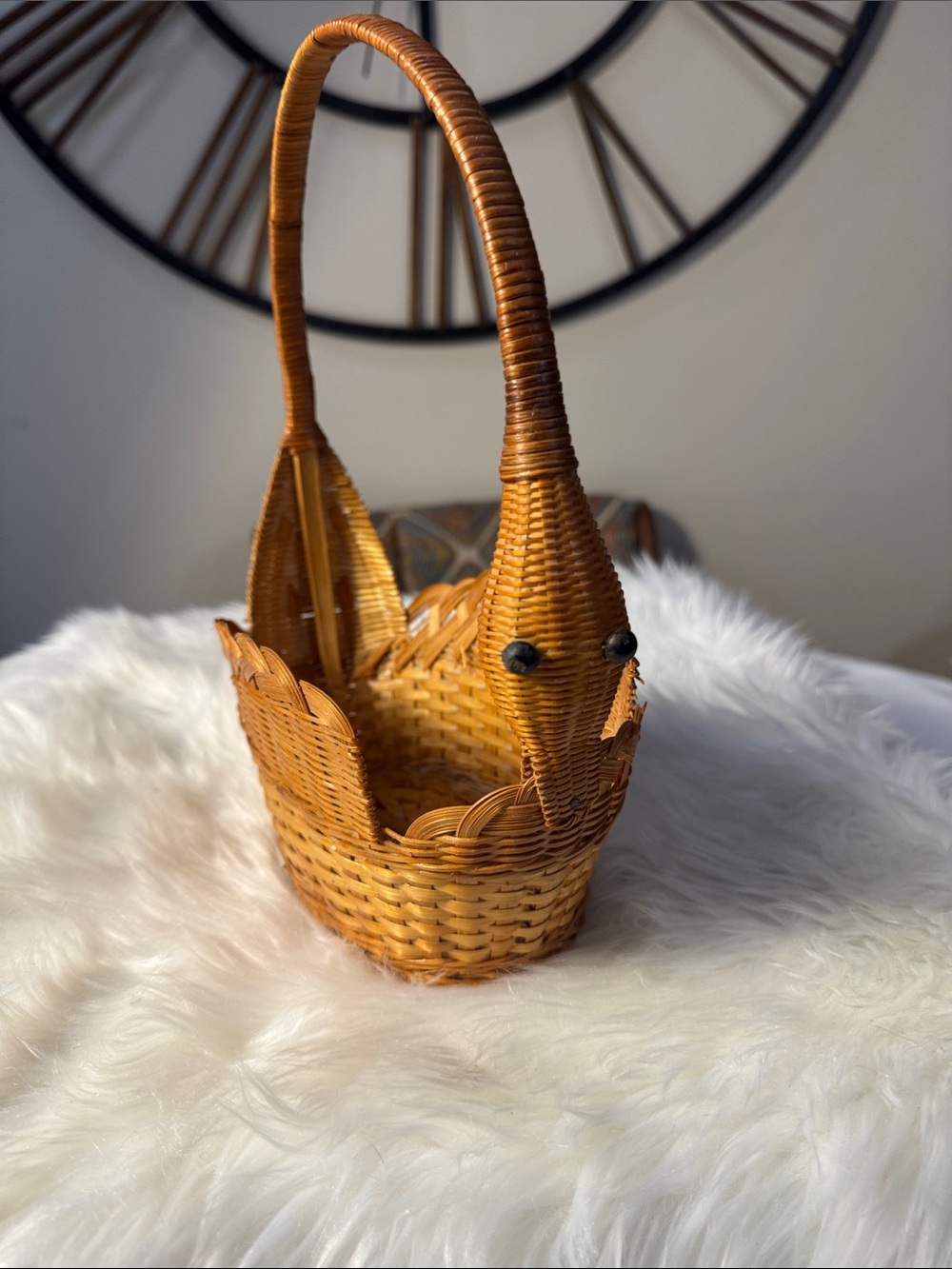 This vintage handwoven wicker and rattan swan-shaped basket.